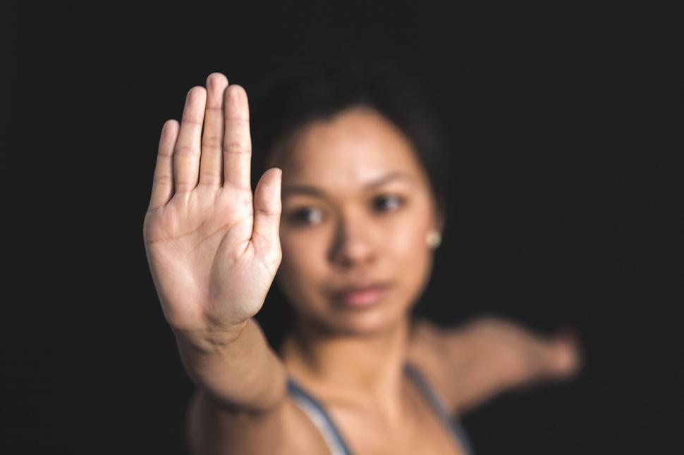 Free Image of Woman with hand raised in stop gesture 