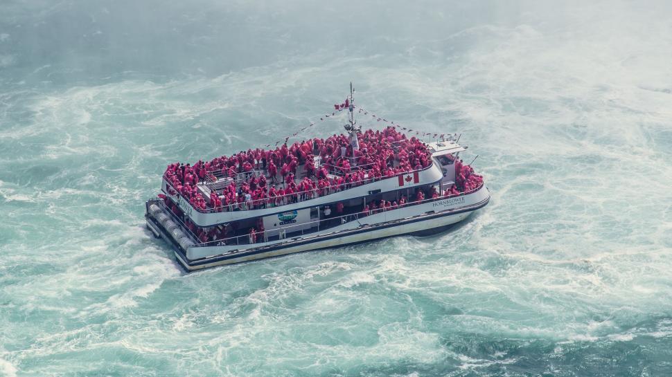 Free Image of Tourist boat amidst turbulent waters near Niagara Falls 