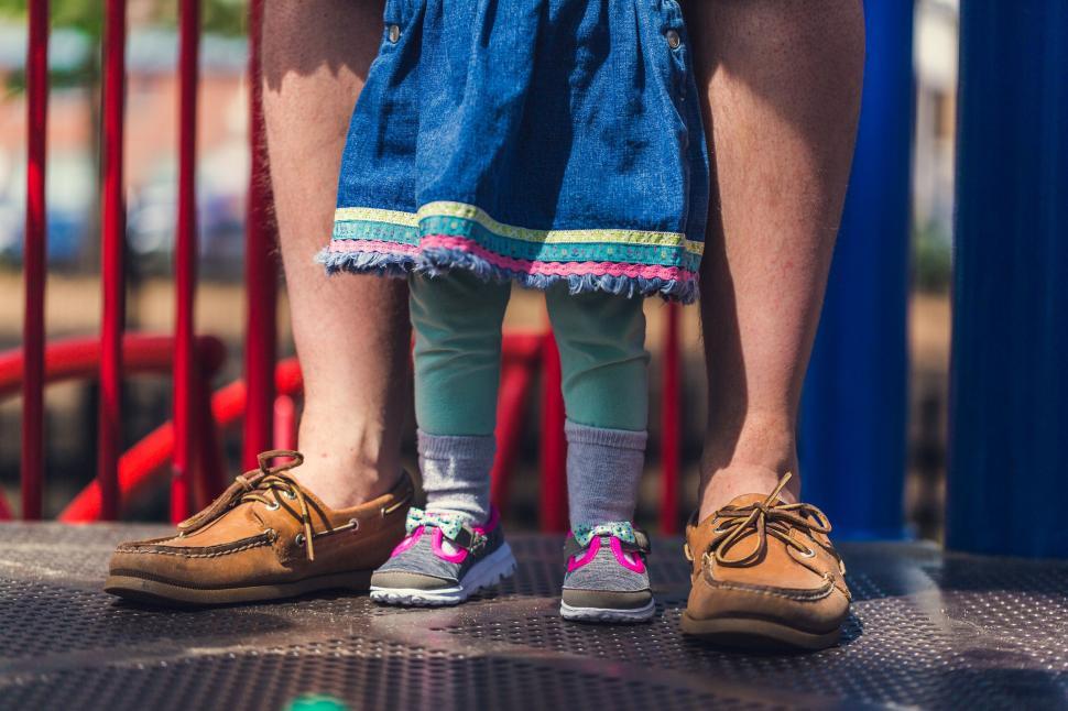 Free Image of Closeup of parent and child standing together 