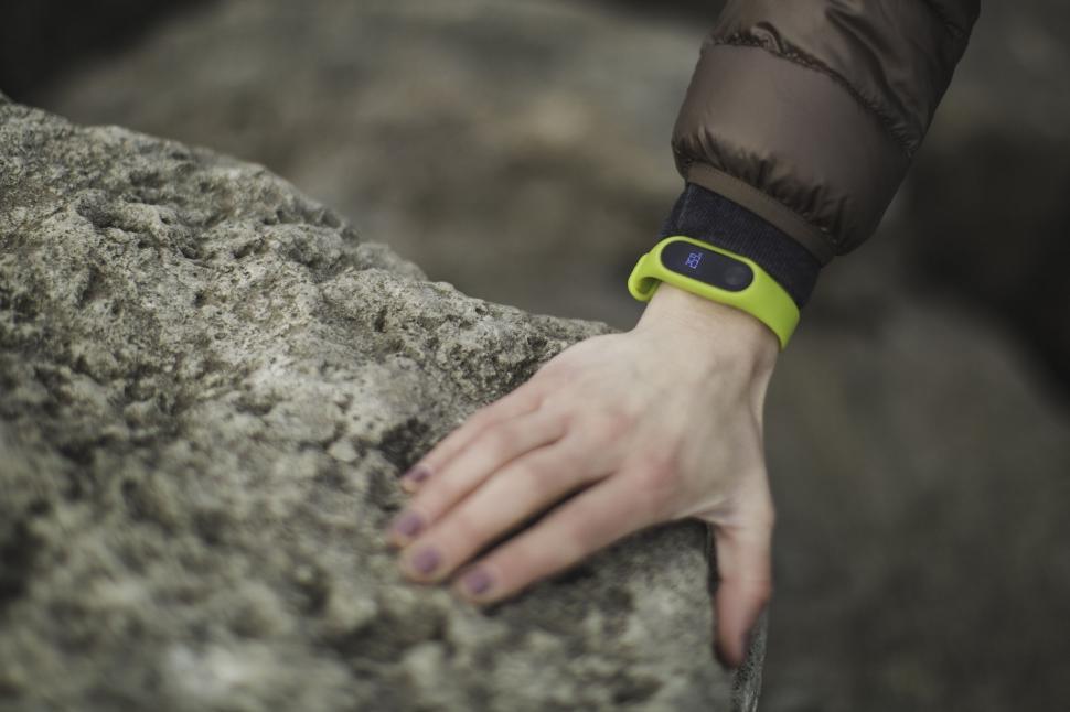 Free Image of Green fitness tracker on a wrist outdoors 