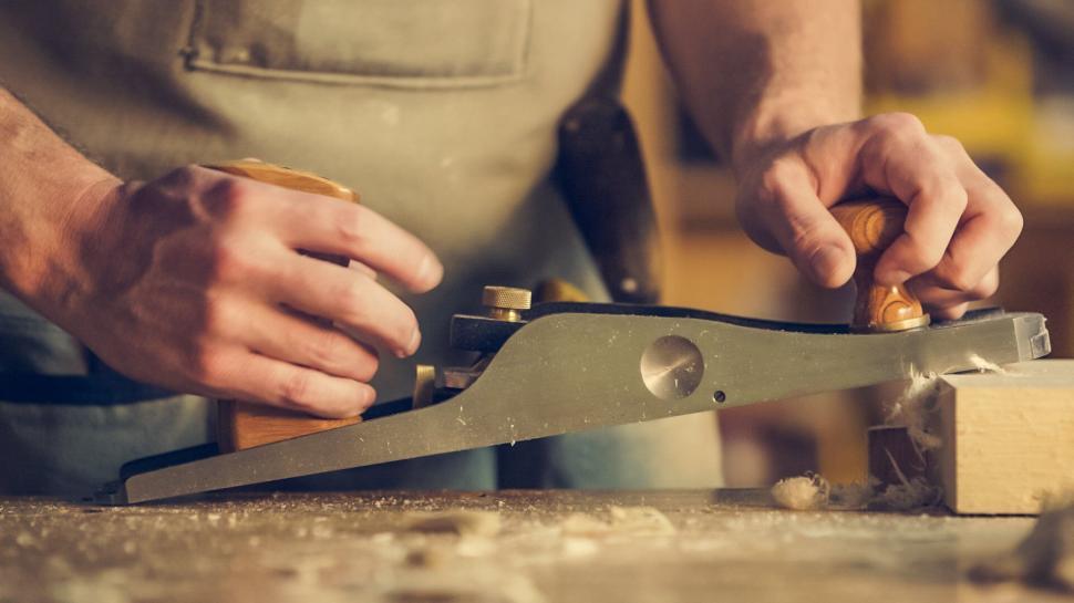 Free Image of Close-up of woodworking with hand plane 