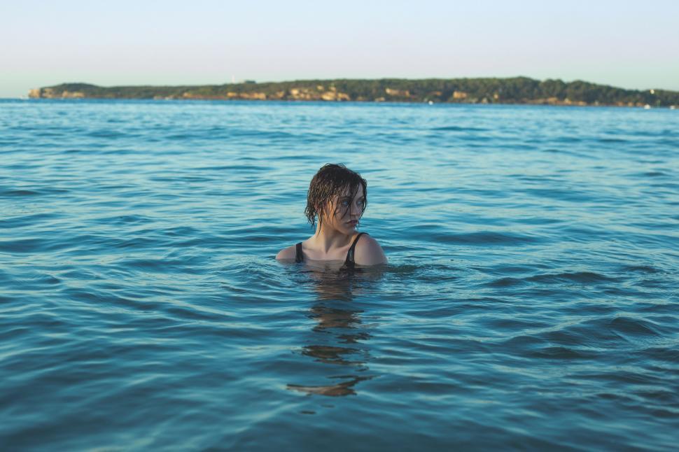 Free Image of Person swimming in blue sea water 