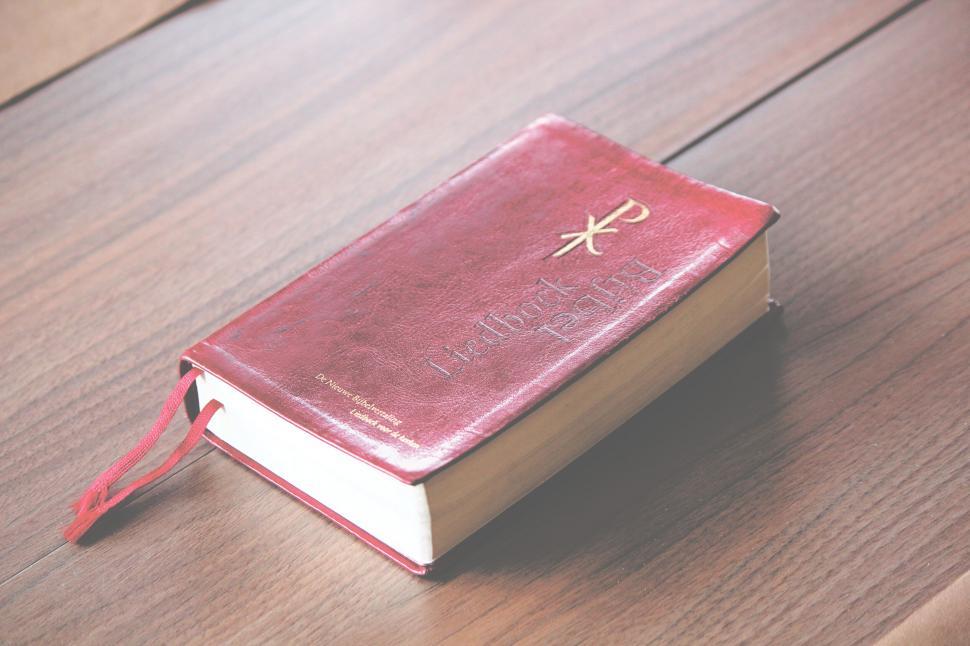 Free Image of Vintage red Bible on a wooden table 