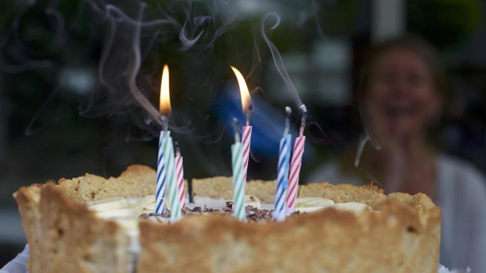Free Image of Birthday pie with three lit candles 
