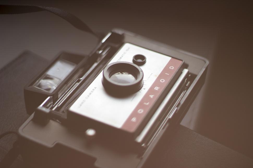 Free Image of Vintage Polaroid cassette on a table 