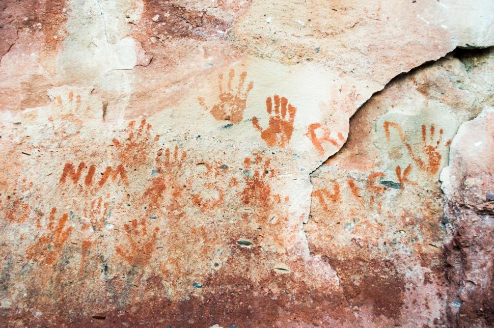 Free Image of Ancient handprints on a cave wall 