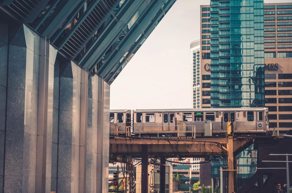 Free Image of Elevated train moving through city architecture 