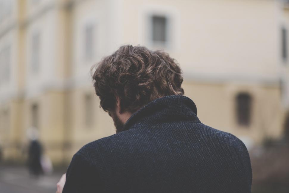 Free Image of Man in coat looking away from camera 