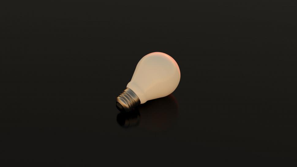 Free Image of Single glowing light bulb on dark background 
