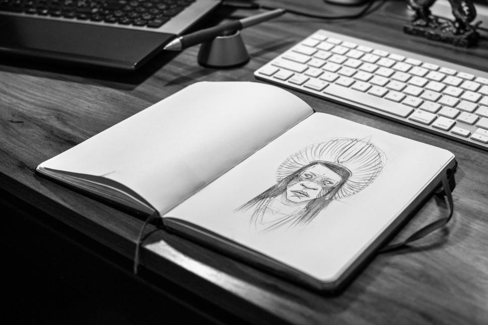 Free Image of Sketch of a Native American in a notebook 