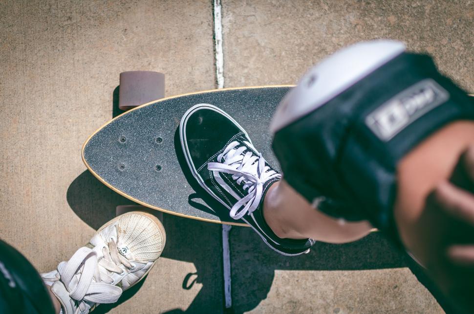 Free Image of Close-up of a skater s feet on a skateboard 
