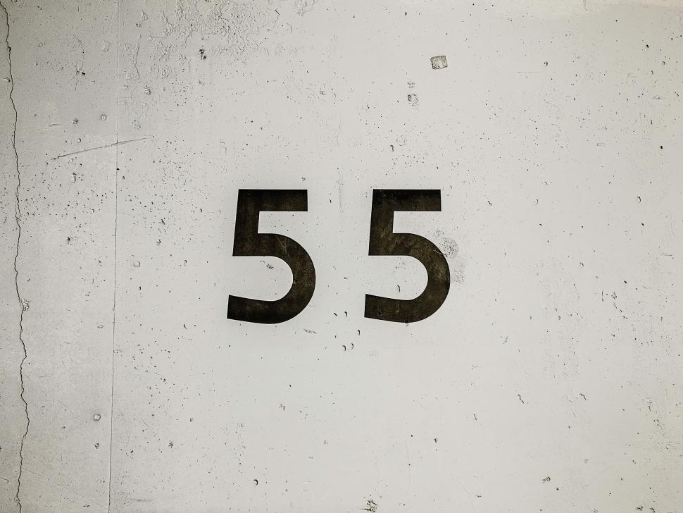 Free Image of Number 55 on Textured White Background 