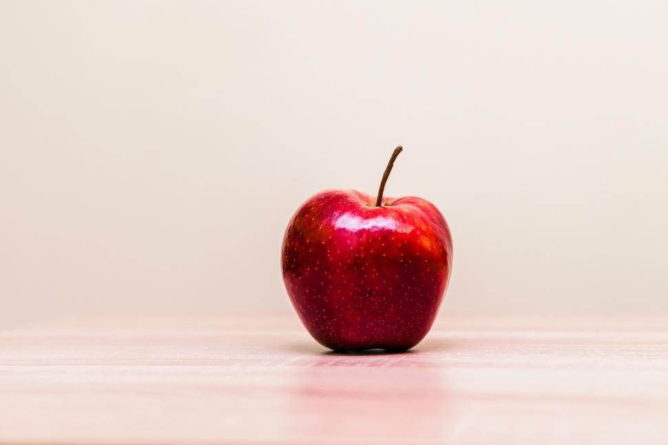 Free Image of Red apple on a soft pink background 