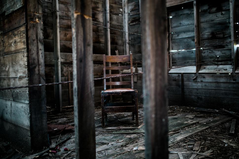 Free Image of Abandoned chair in a desolate building 