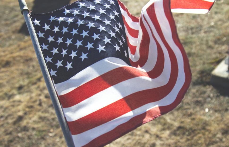 Free Image of American flag waving in soft focus 