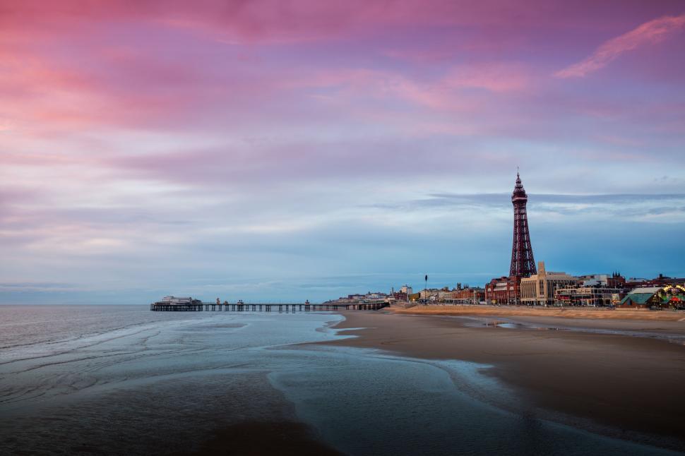 Free Image of Serene Beachscape with Iconic Tower 