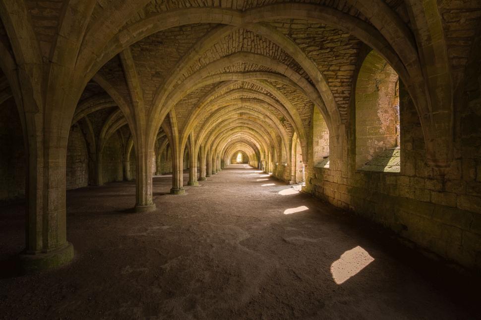 Free Image of Ancient abbey ruins with impressive arches 