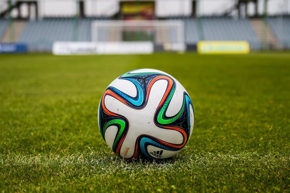 Free Image of Soccer ball on a lush green field 