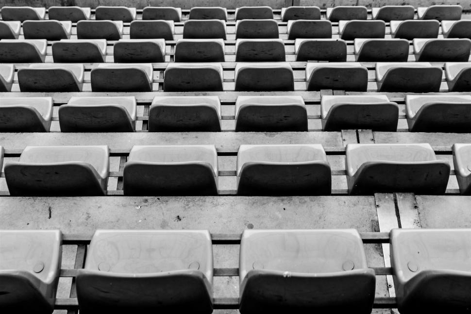 Free Image of Empty stadium seats in black and white 