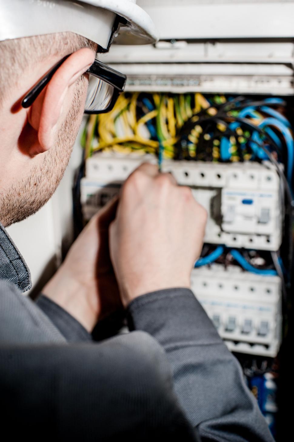 Free Image of Electrician working on electrical panel 