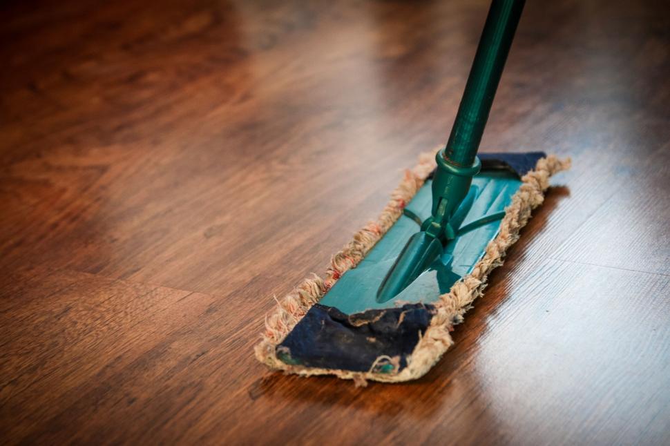 Free Image of Mop cleaning a wooden floor in a house 