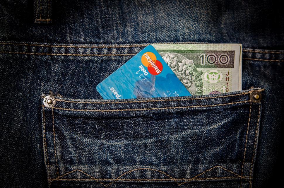 Free Image of Cash and card in denim pocket close-up 
