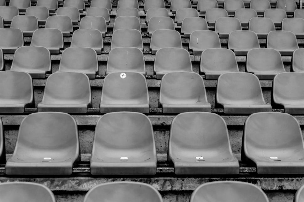 Free Image of Empty stadium seats in black and white tone 