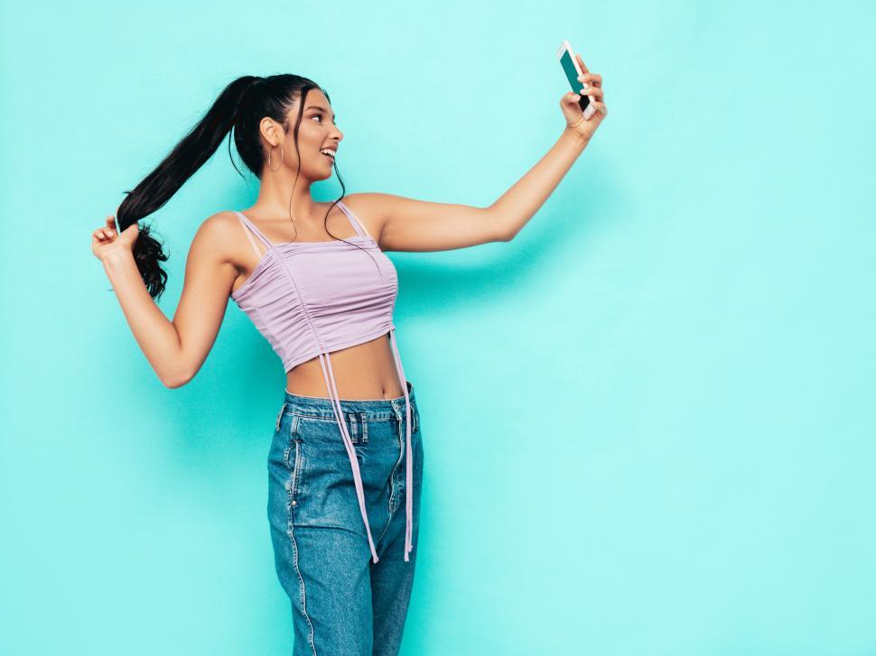 Free Image of A woman holding a phone 