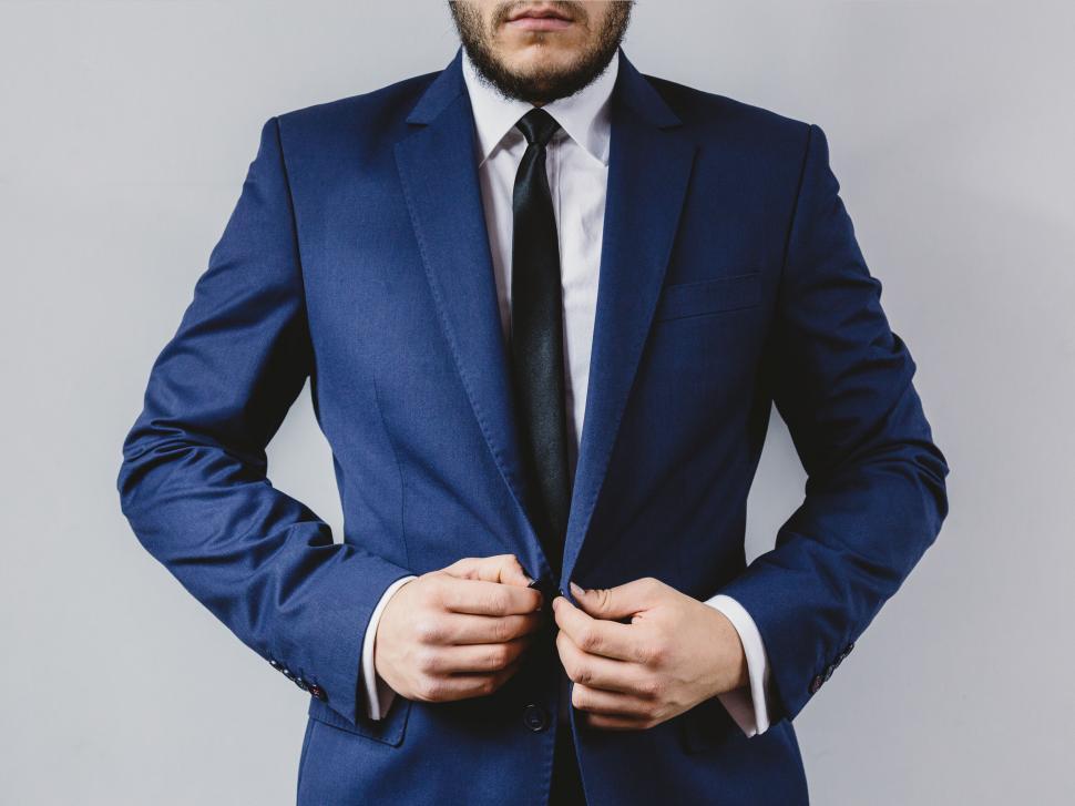 Free Image of Well-dressed man in a fitted blue suit 