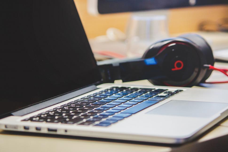 Free Image of Laptop and headphones on a workspace 