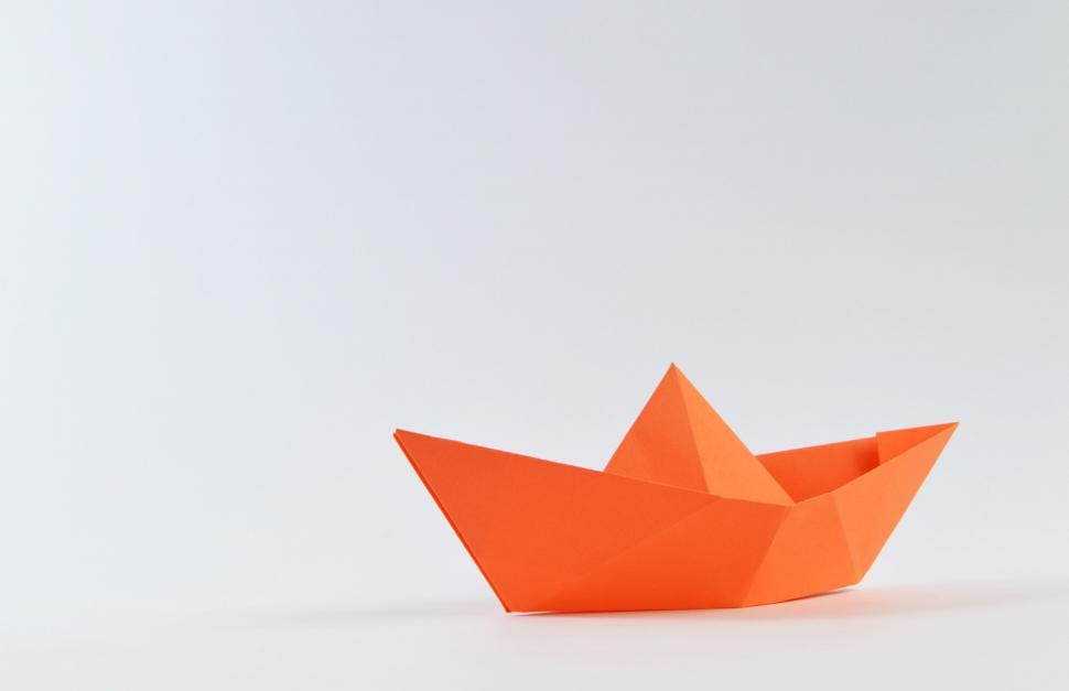 Free Image of Orange paper boat on white background 