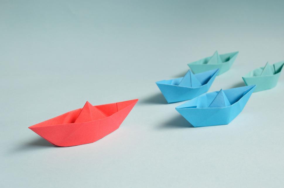 Free Image of Colorful paper boats on blue background 