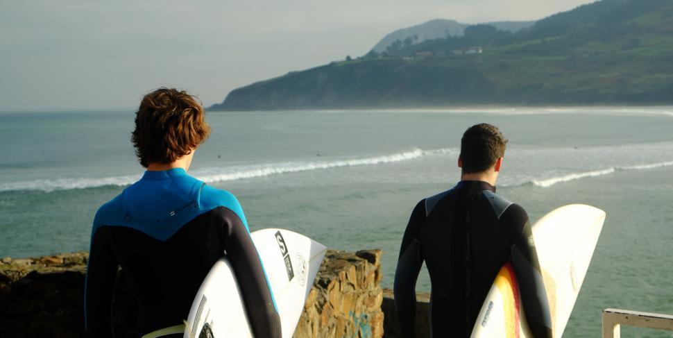 Free Image of Surfers gazing at the sea before surfing 