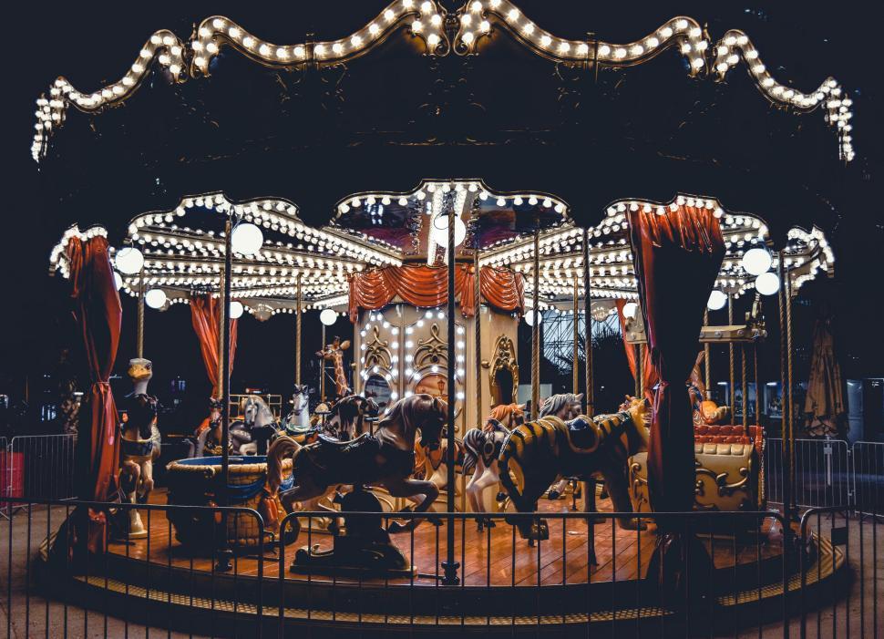 Free Image of Night shot of a carousel with bright festive lights 