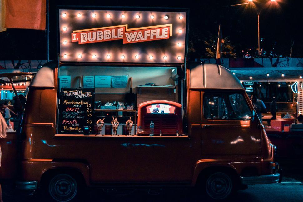 Free Image of Night market with vibrant Bubble Waffle shop 