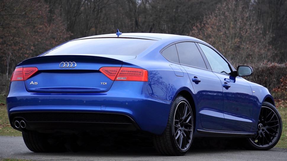 Free Image of Rear view of blue Audi A5 parked outdoors 