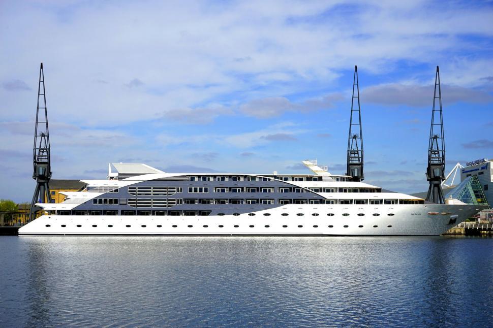 Free Image of Modern Yacht Moored at Dock with City View 