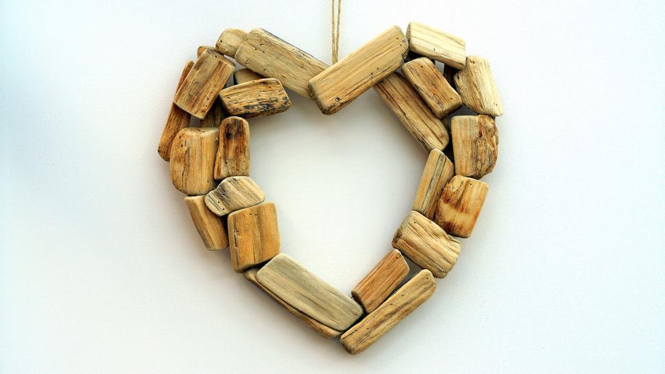 Free Image of Rustic wooden heart shaped wreath hanging 