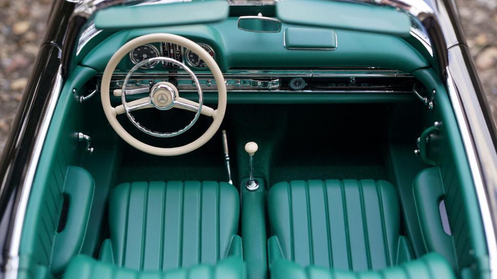 Free Image of Vintage car interior with elegant green seats 