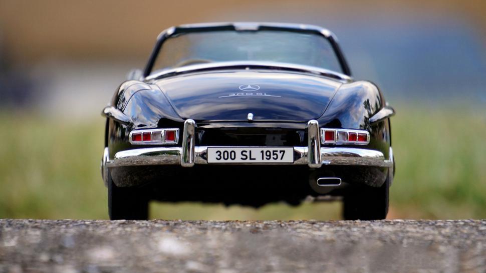 Free Image of Classic Black Mercedes 300 SL Rear View on Road 