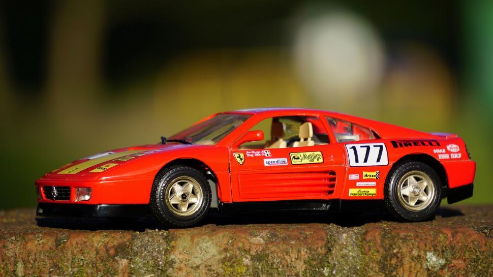 Free Image of Red Ferrari Racing Model with Racing Stickers 