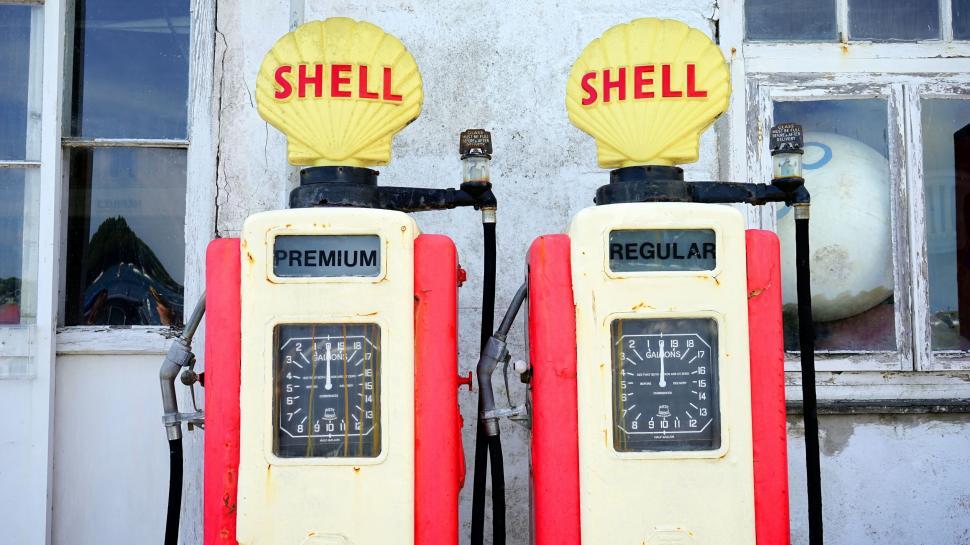 Free Image of Vintage Shell gas pumps against old wall 