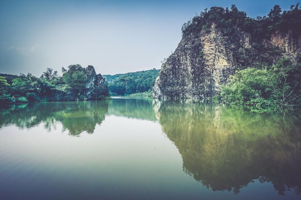 Free Image of Tranquil lake surrounded by limestone cliffs 