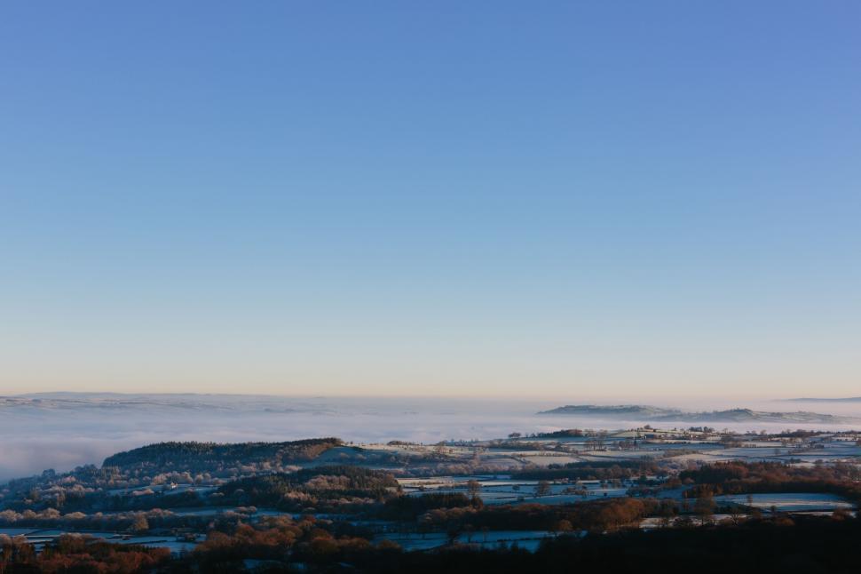 Free Image of Misty morning over a calm rural landscape 