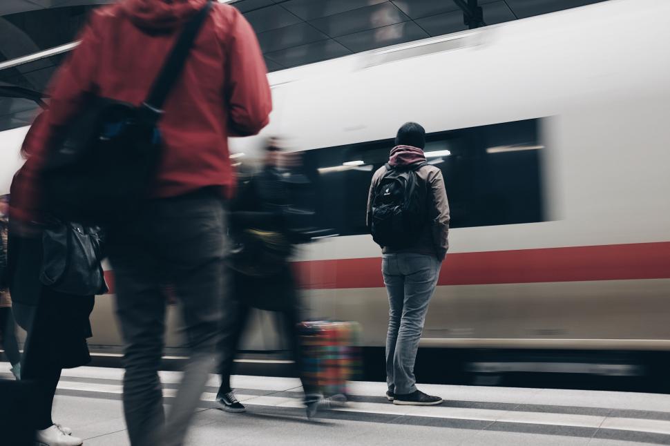Free Image of Passengers at a train station blur movement 
