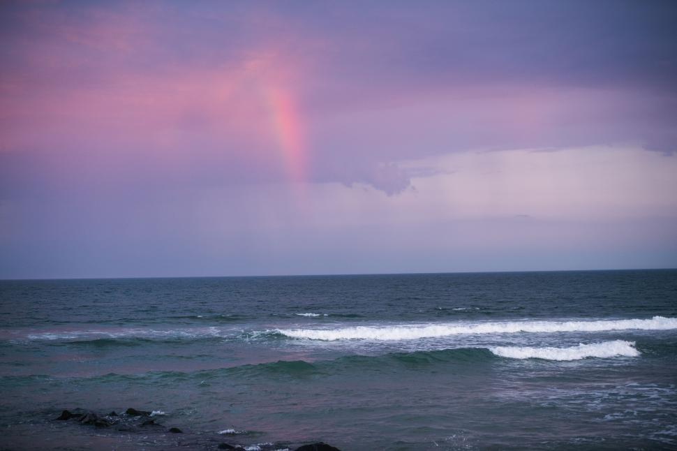 Free Image of Twilight sea view with a faint rainbow 