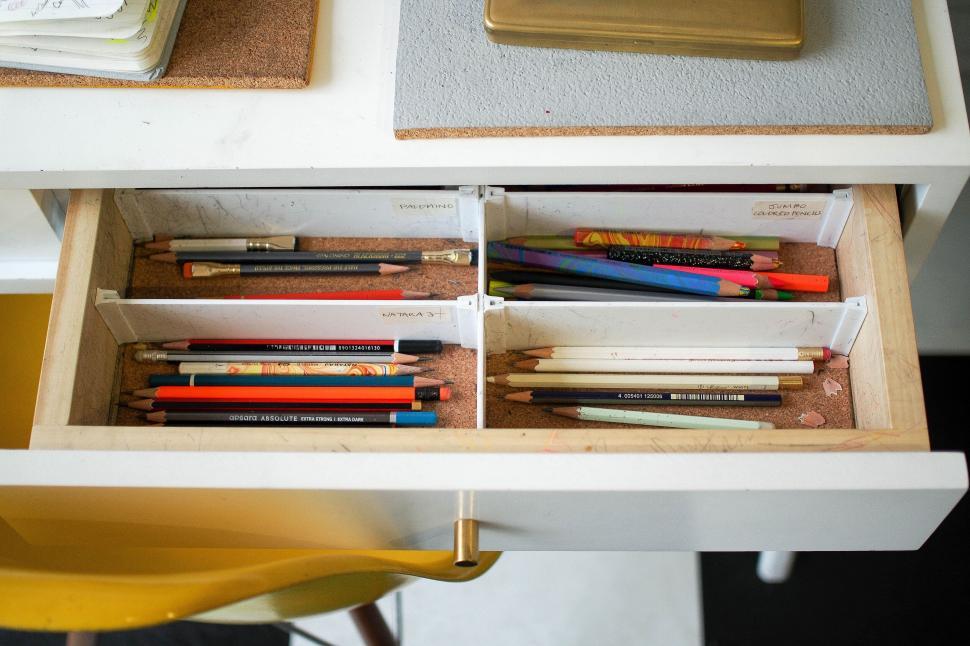 Free Image of Open drawer with assorted pencils and pens 