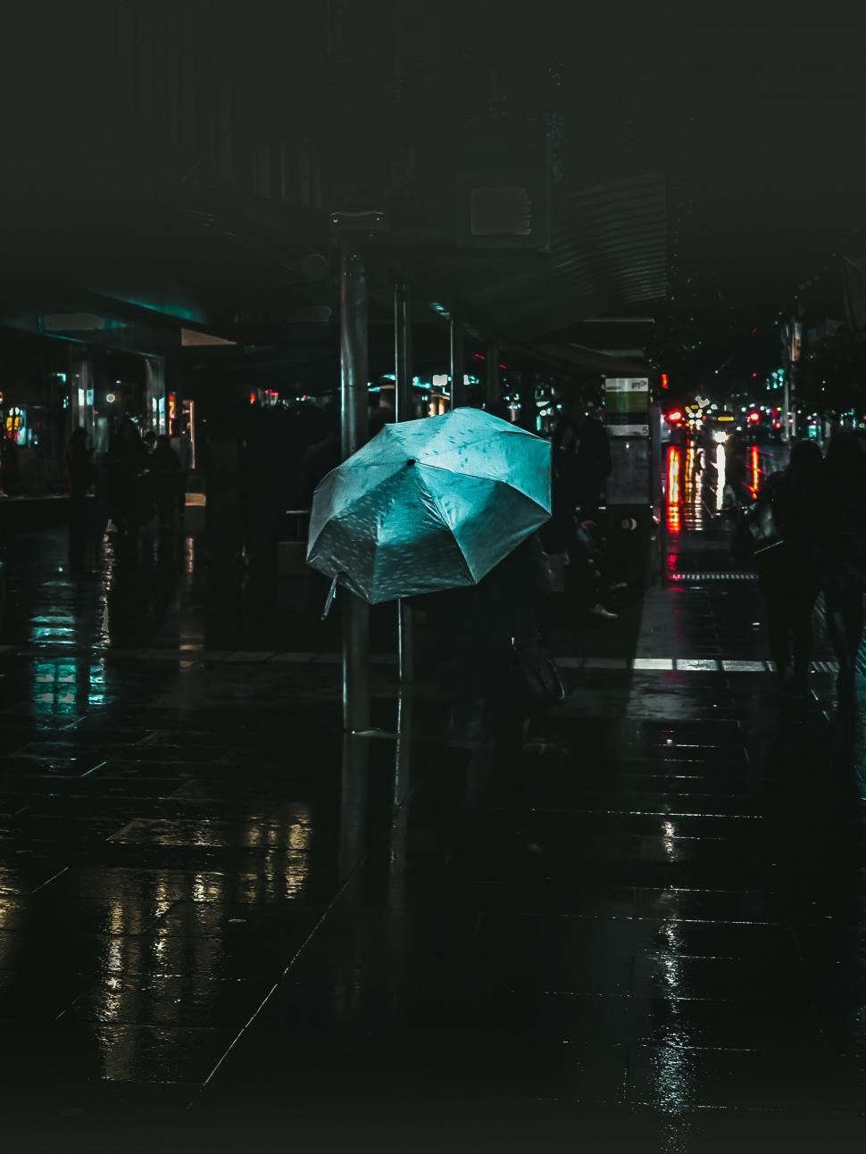 Free Image of Rainy street at night with umbrella 