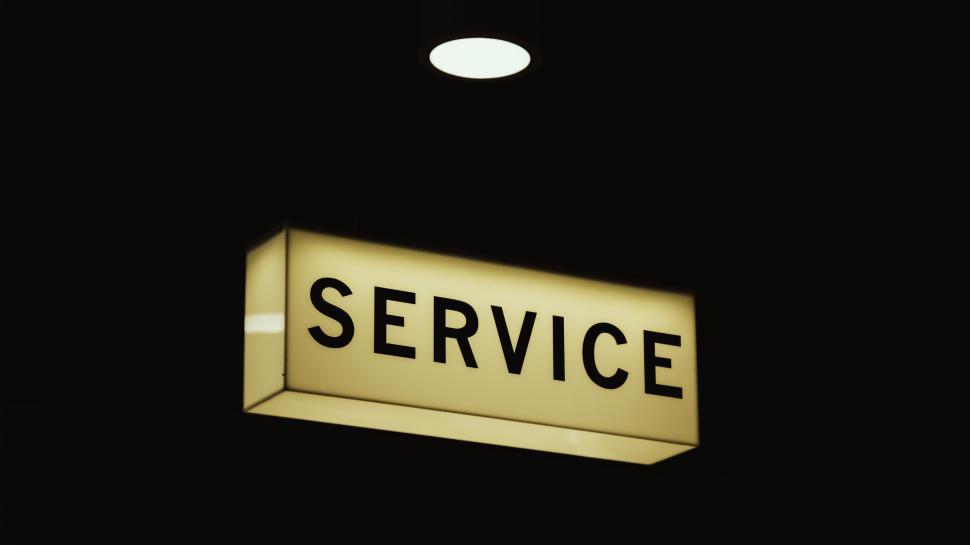 Free Image of Illuminated  SERVICE  sign against black 