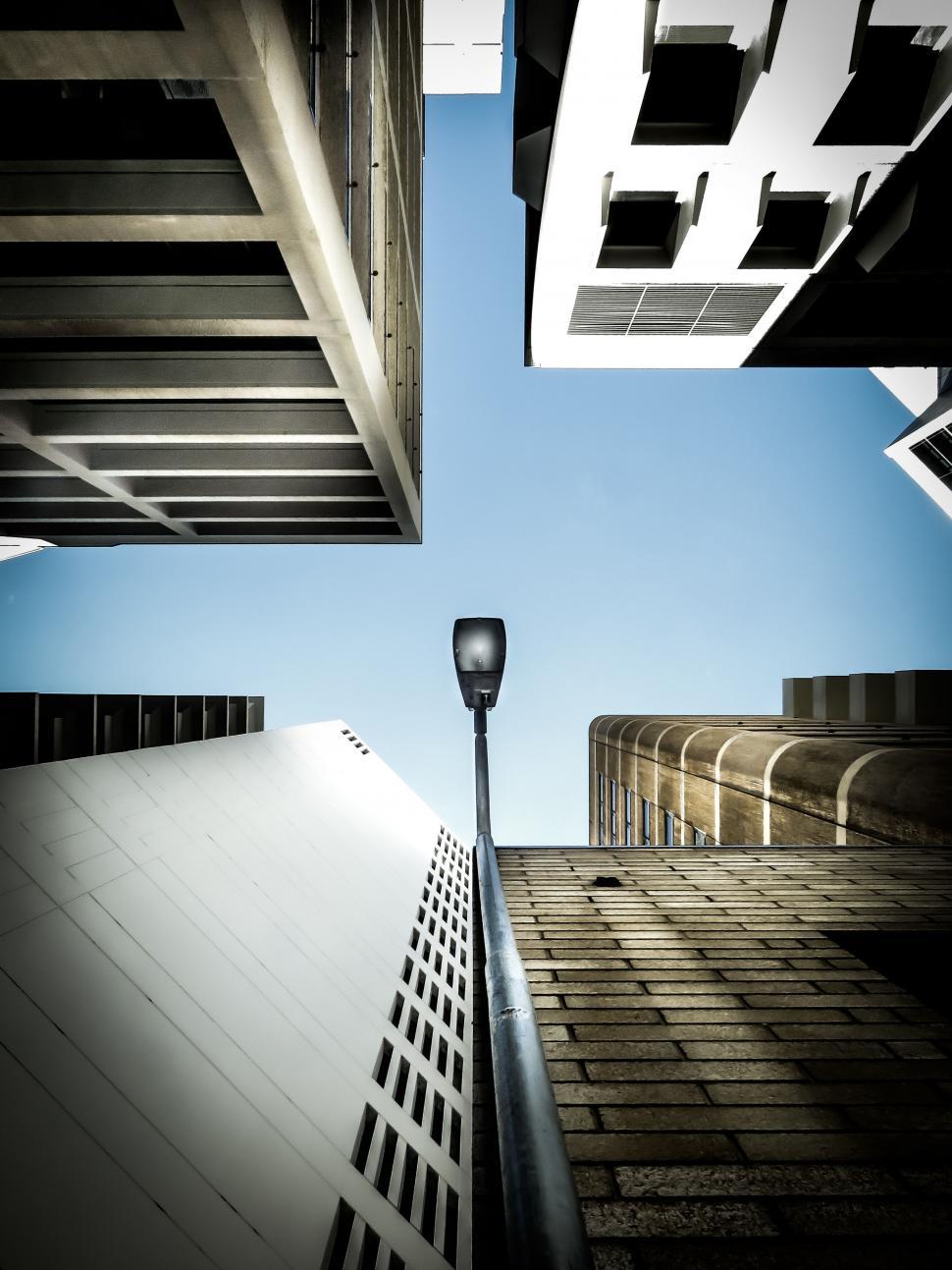 Free Image of Looking up at skyscrapers on a sunny day 